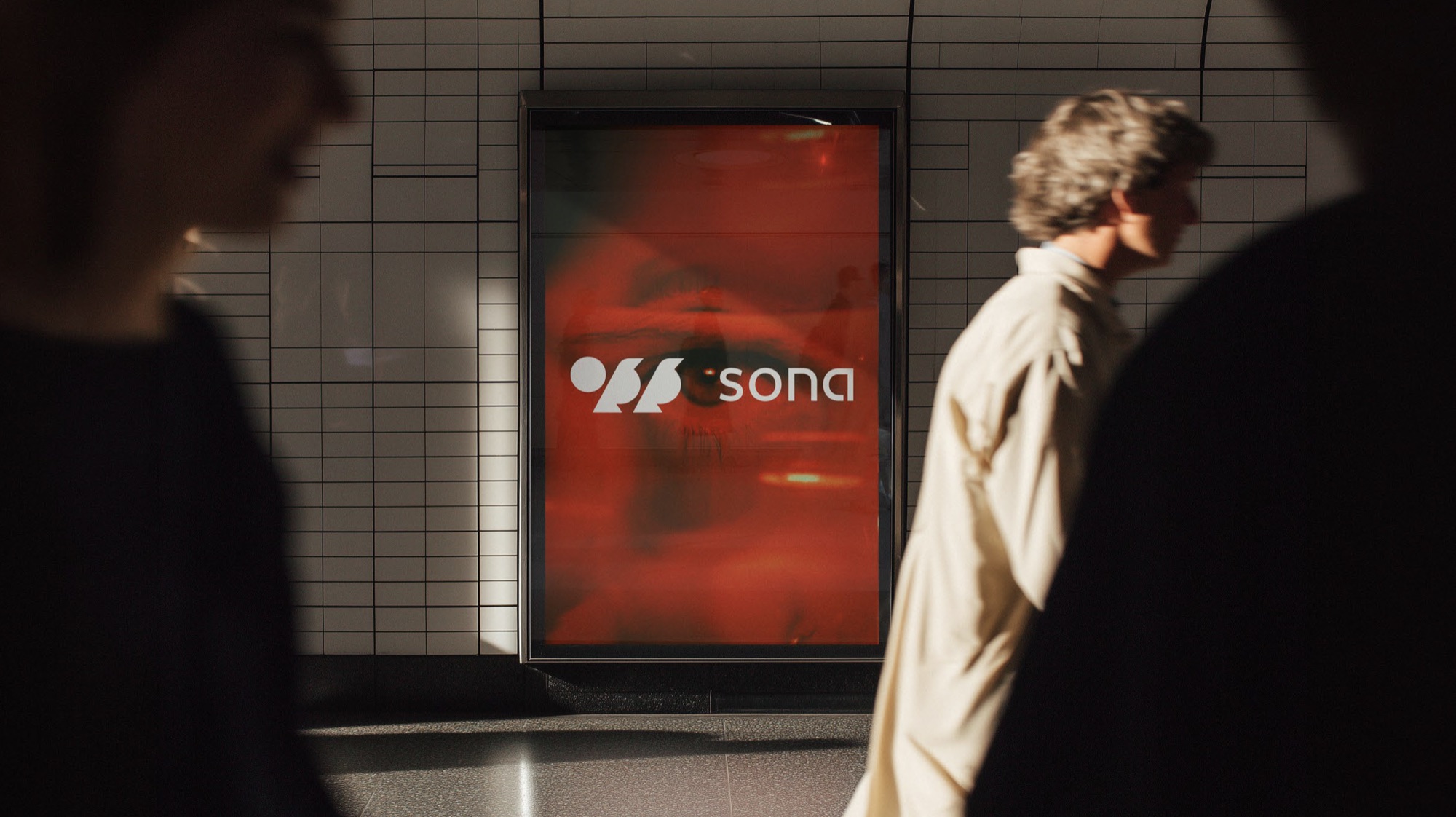 A SONA billboard in a subway passage